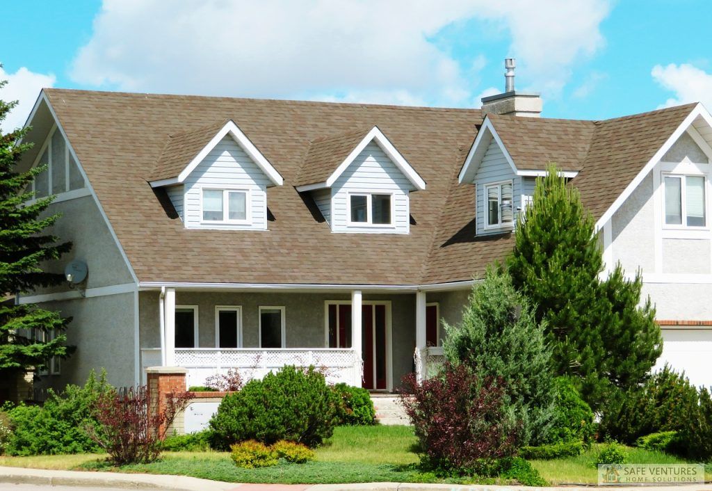 a farm house with a lawn